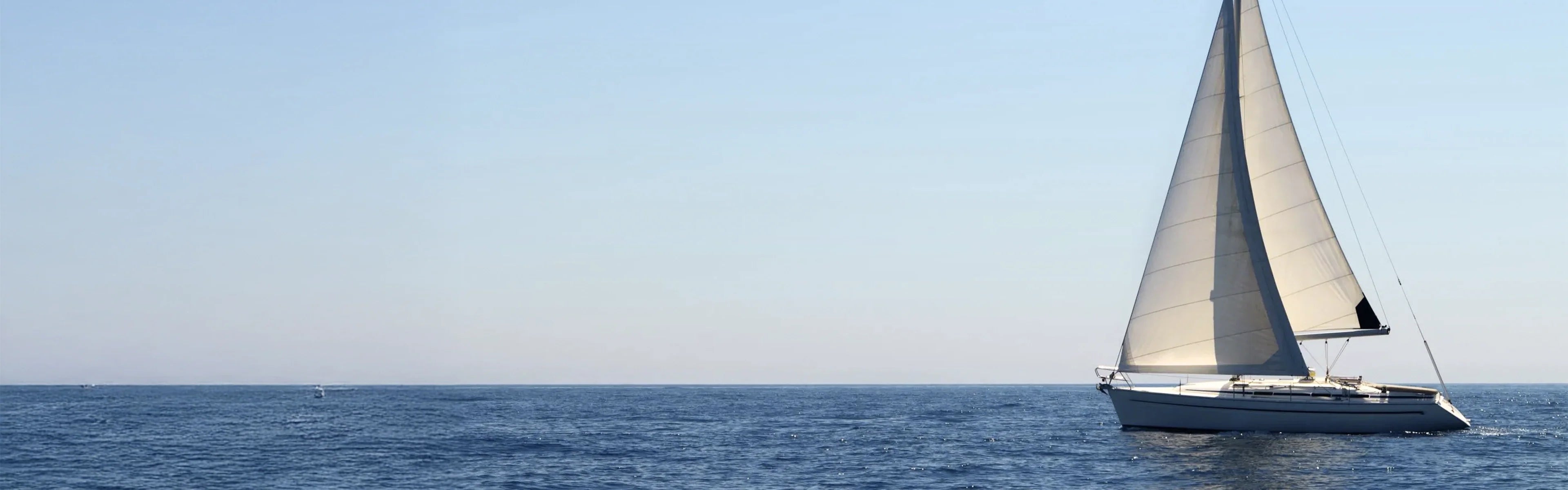 Sailboat cruising across open sea under sunlight with marine house power system - Power Queen US