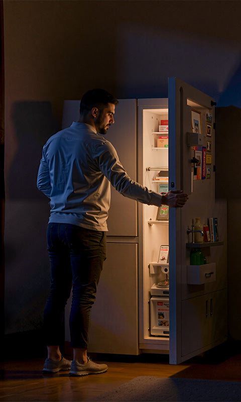 Power Queen lithium batteries providing home backup power, shown with refrigerator