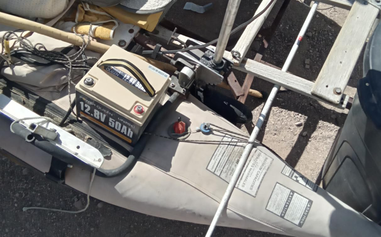 Power Queen 12v 50ah lithium battery for trolling motor on a boat deck